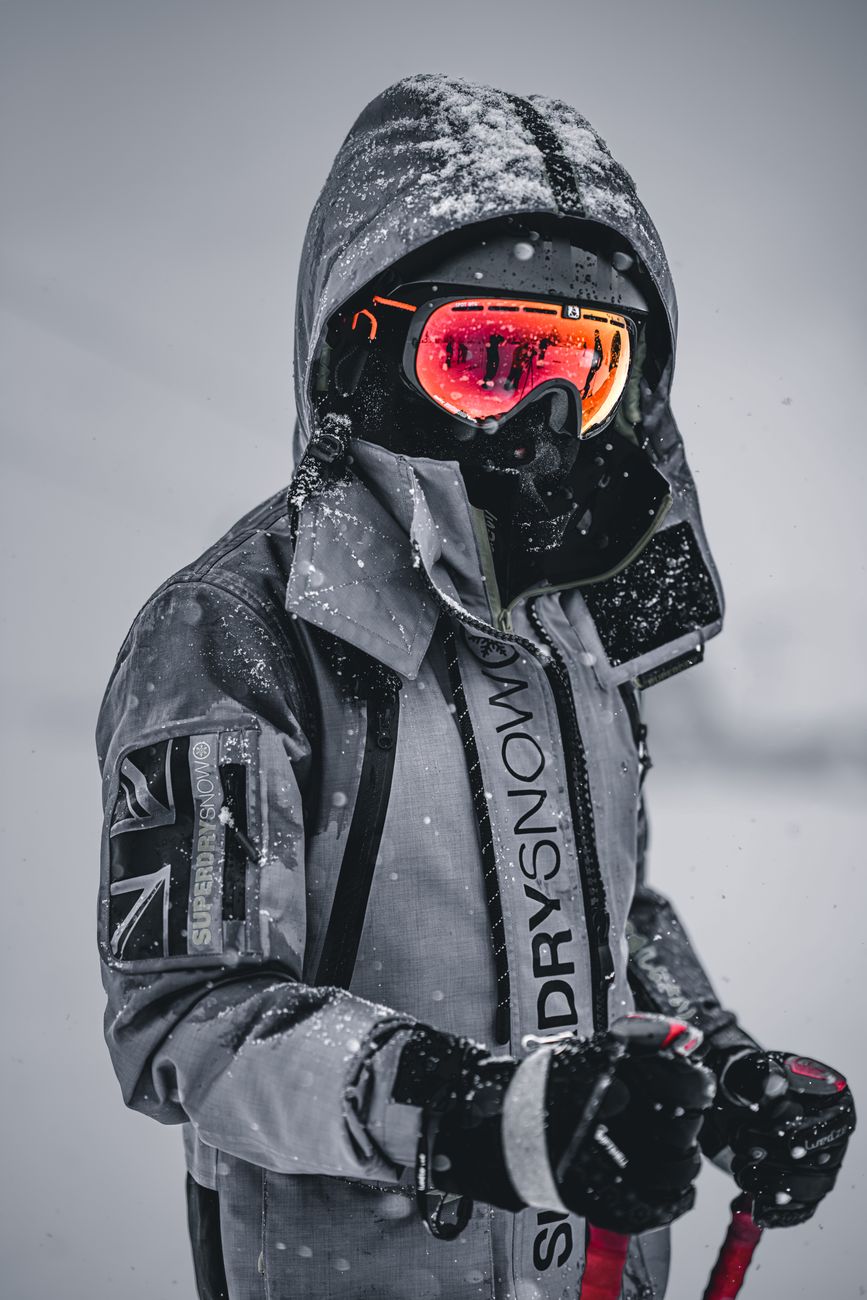 a person wearing a gray skiing gear